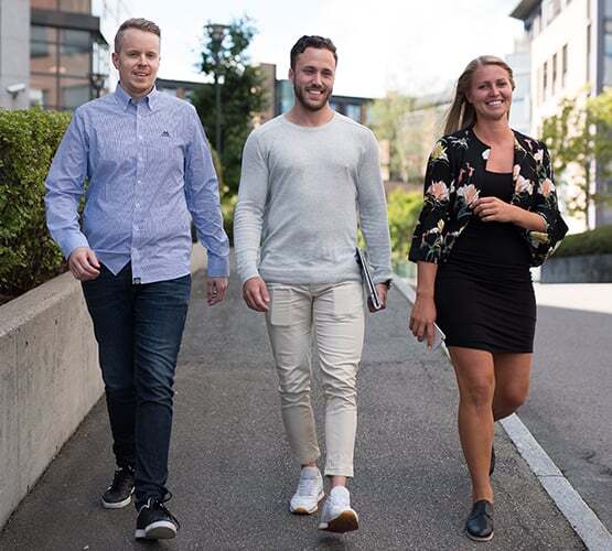 ksp-l-555x500-modern_organization_two_men_and_lady_walking_down_the_street